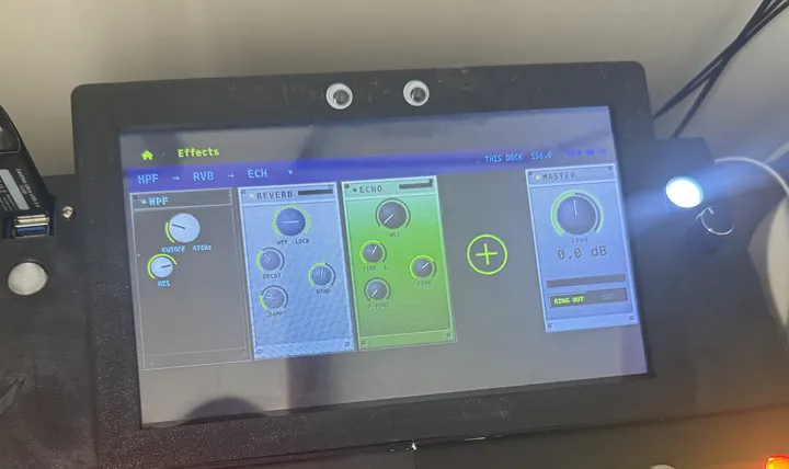 The deck's screen showing three effect cards labelled HPF, REVERB and ECHO with round knobs, a plus sign to add another, and a MASTER card reading 0.0 dB.
