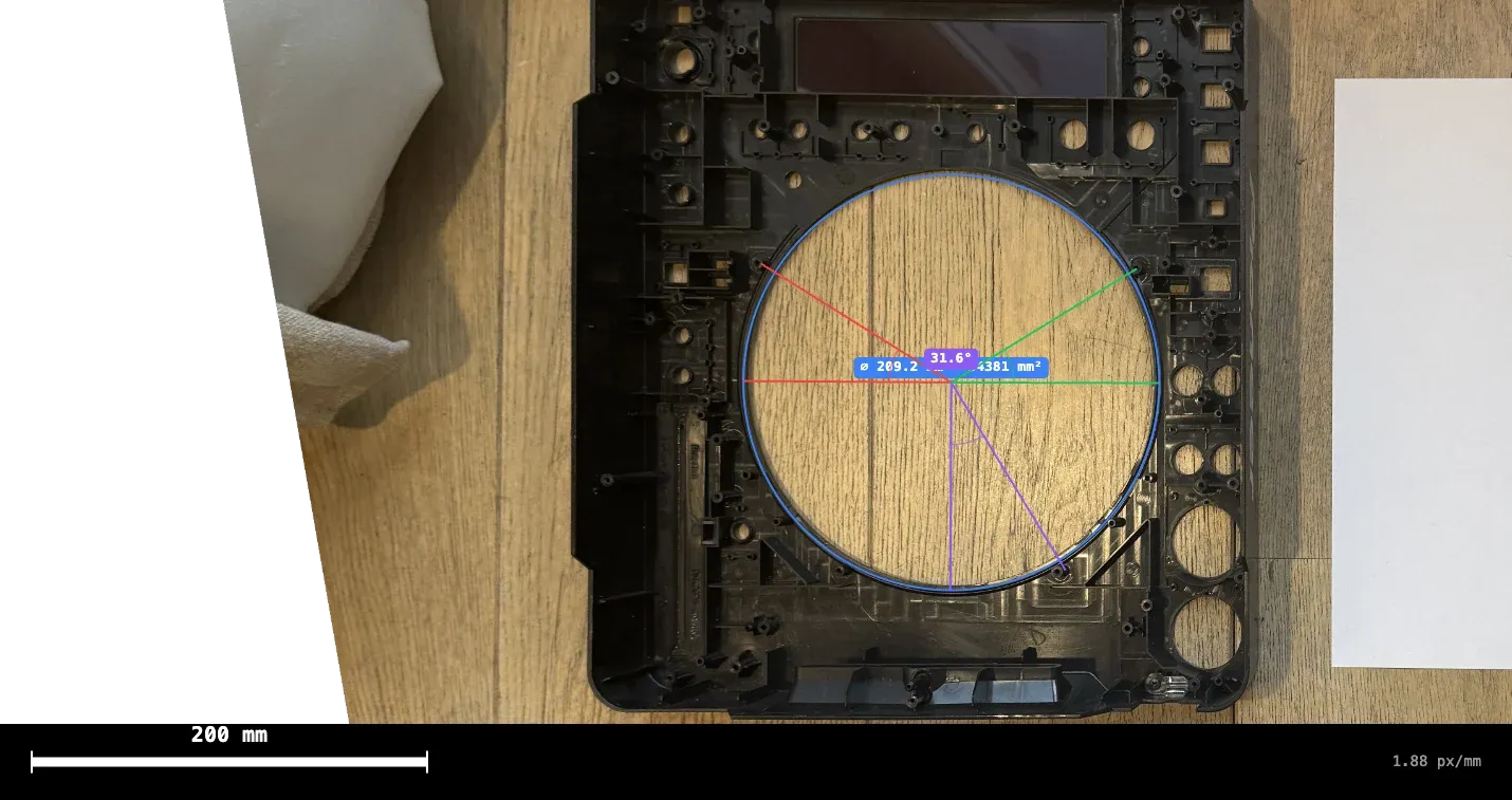 The bottom case of a CDJ, empty, with the jog's opening measured.