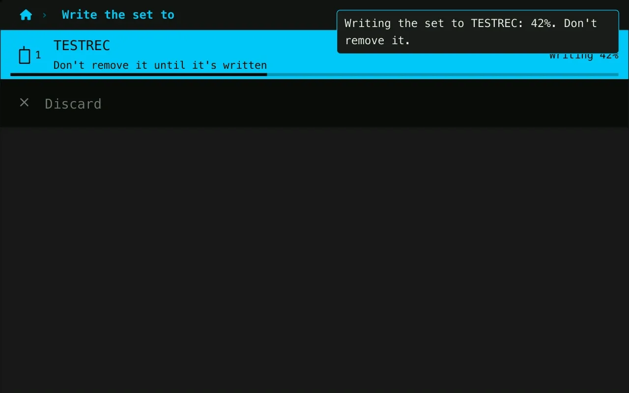 The set being written to a stick, 42 % done, with a warning not to remove the stick.